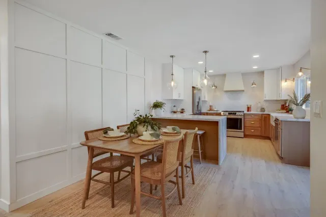 a bedroom with a bed and a mirror