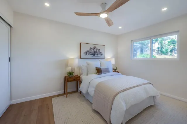 a backyard of a house with table and chairs