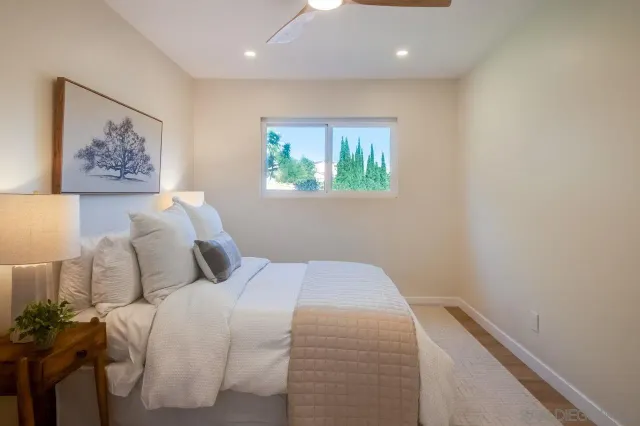 a view of a yard with a house in the background