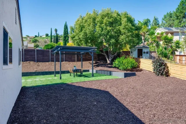 a kitchen with a stove a sink and a refrigerator