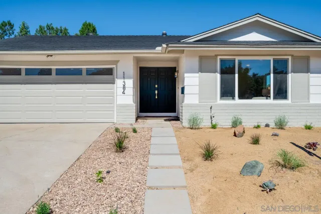 a view of a hallway with bathroom