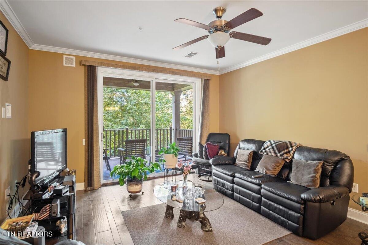315 Centennial Bluff Boulevard Oak Ridge, TN 37830 - Photo 12 of 24 a living room with furniture and floor to ceiling windows