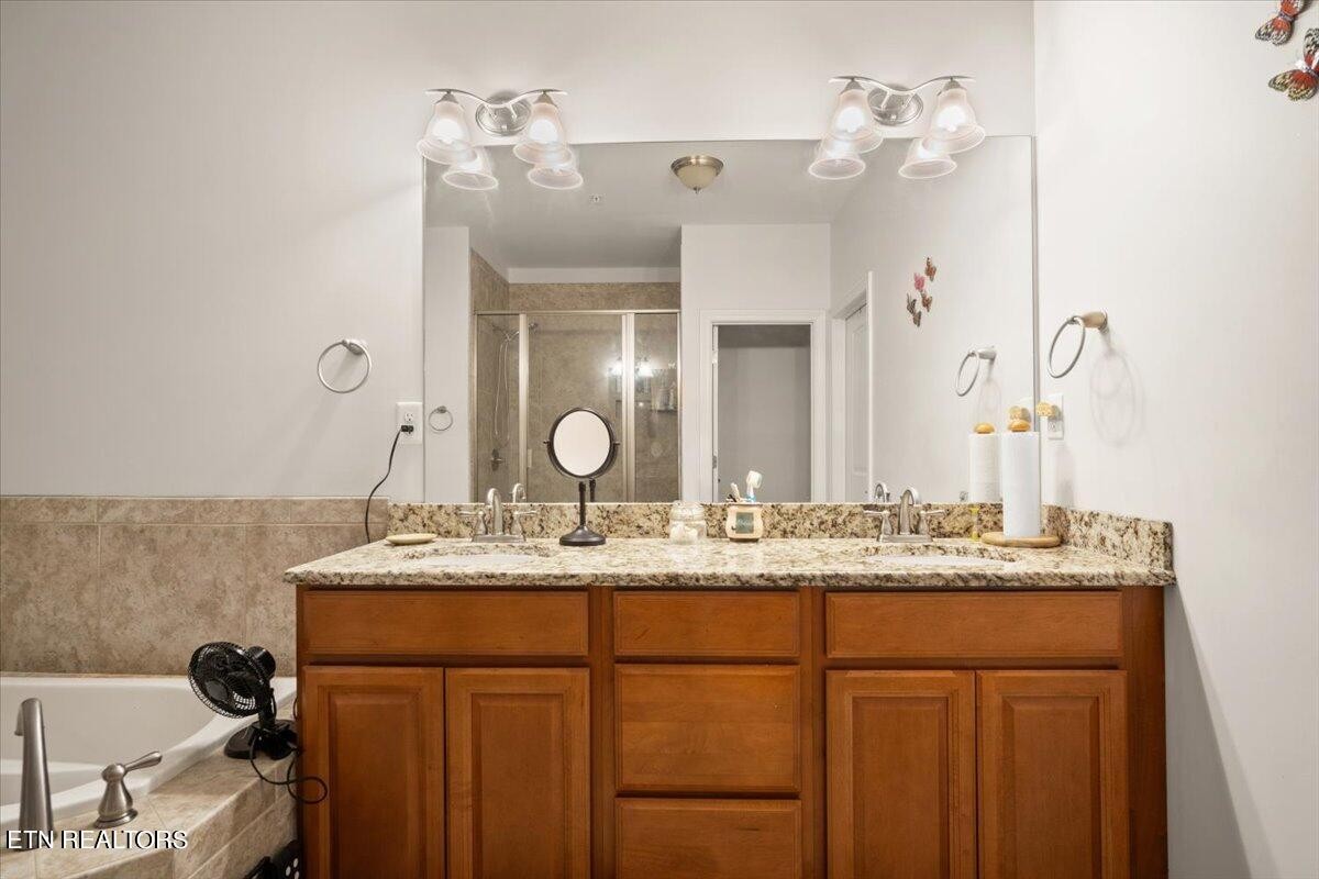315 Centennial Bluff Boulevard Oak Ridge, TN 37830 - Photo 16 of 24 a bathroom with a granite countertop sink and a mirror