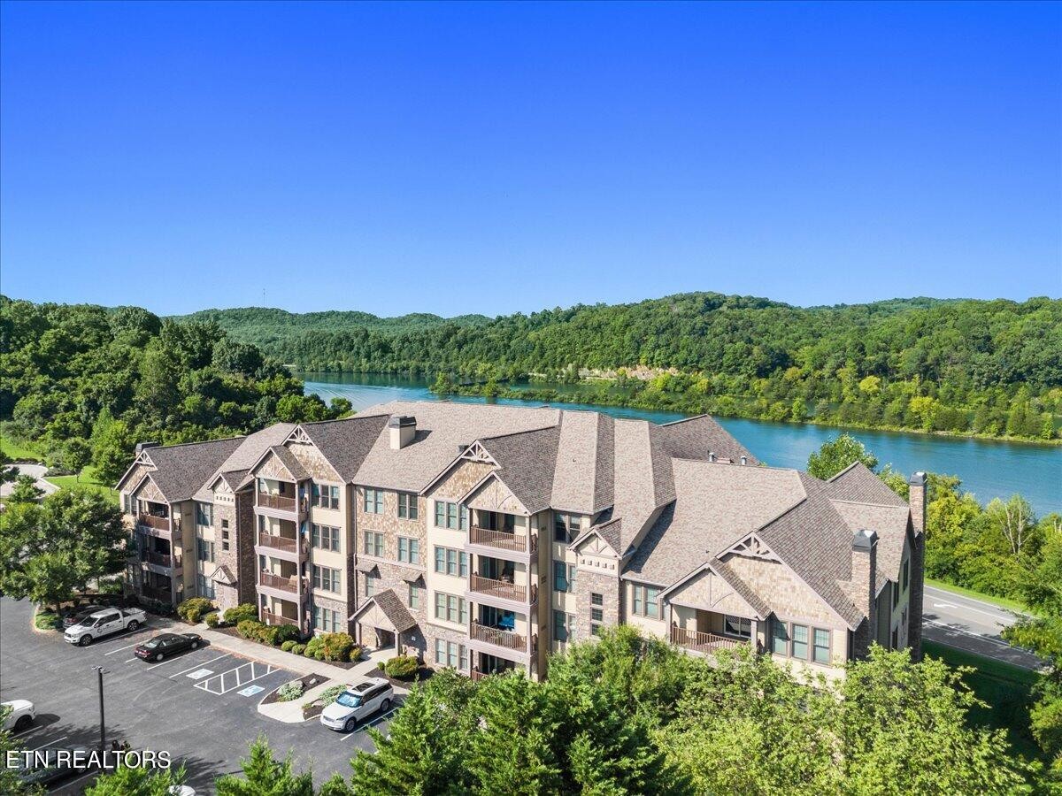 315 Centennial Bluff Boulevard Oak Ridge, TN 37830 - Photo 2 of 24 an aerial view of a house with a garden and lake view