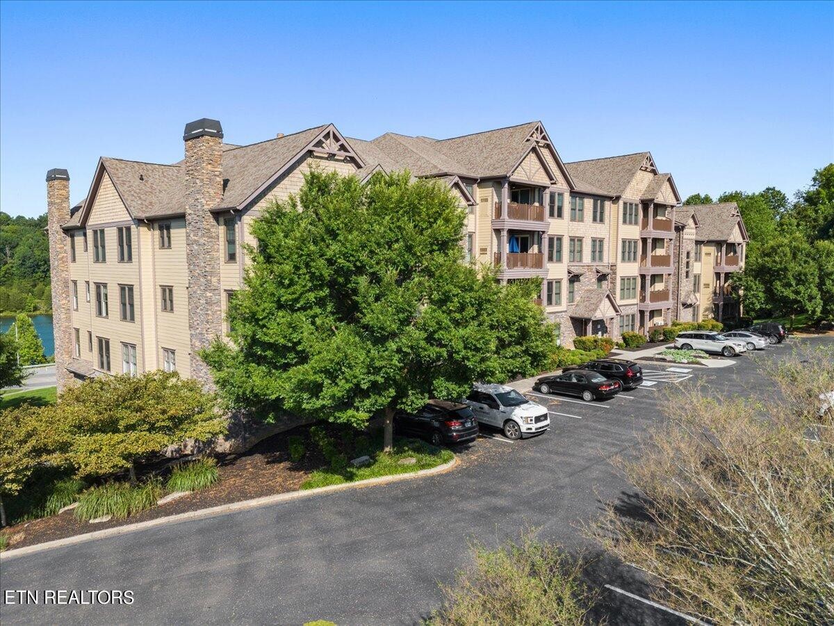 315 Centennial Bluff Boulevard Oak Ridge, TN 37830 - Photo 3 of 24 a view of a blue house with a yard and potted plants