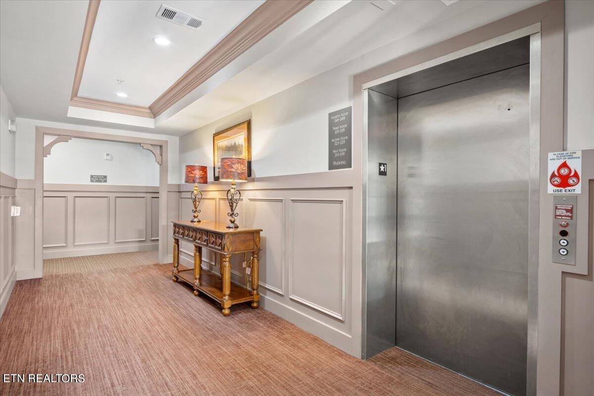 315 Centennial Bluff Boulevard Oak Ridge, TN 37830 - Photo 6 of 24 a kitchen with white cabinets and wooden floor