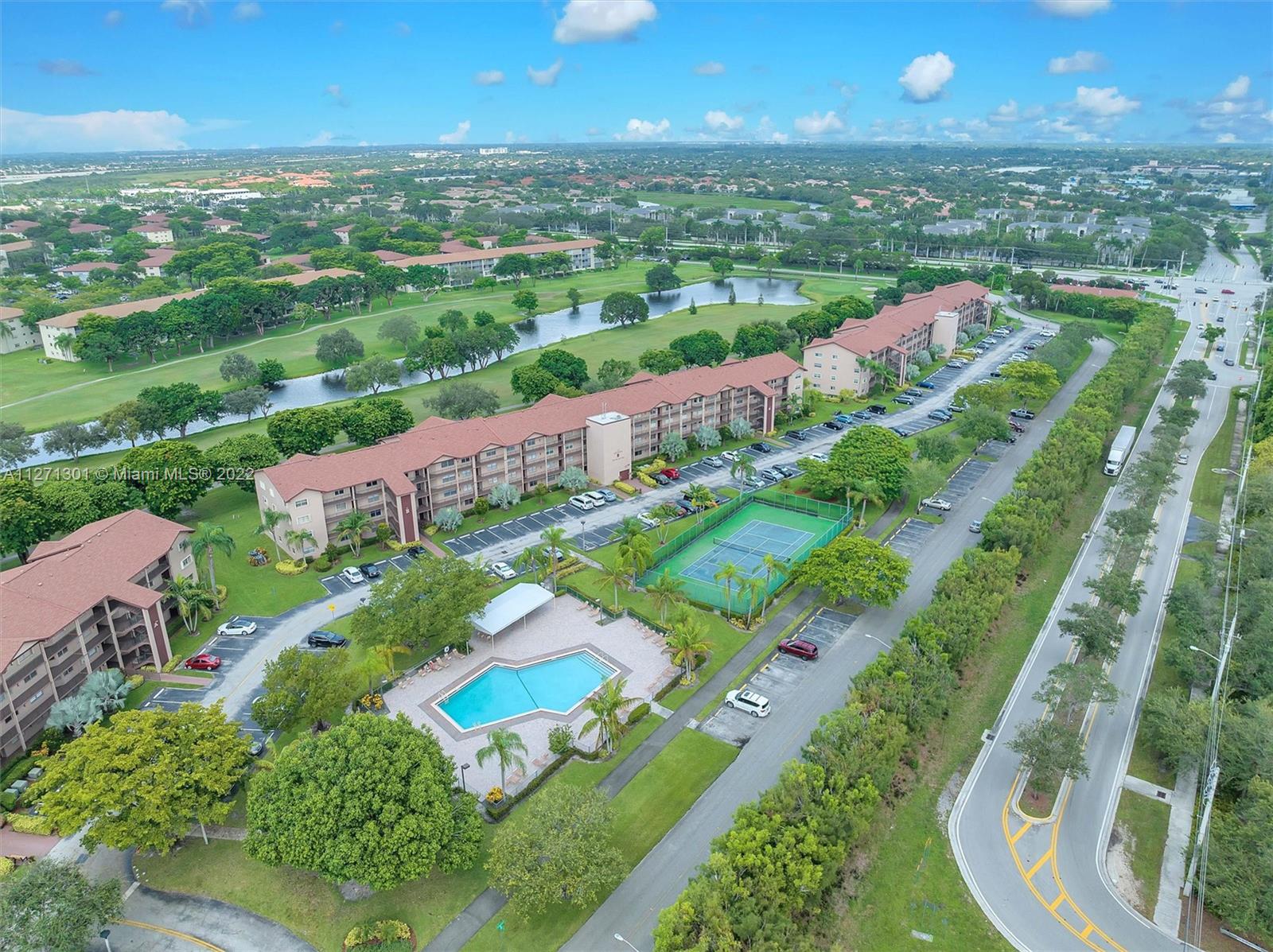 300 Southwest 130th Terrace, Unit 106B Pembroke Pines, FL 33027 - Photo 34 of 43 an aerial view of residential houses with outdoor space and pool