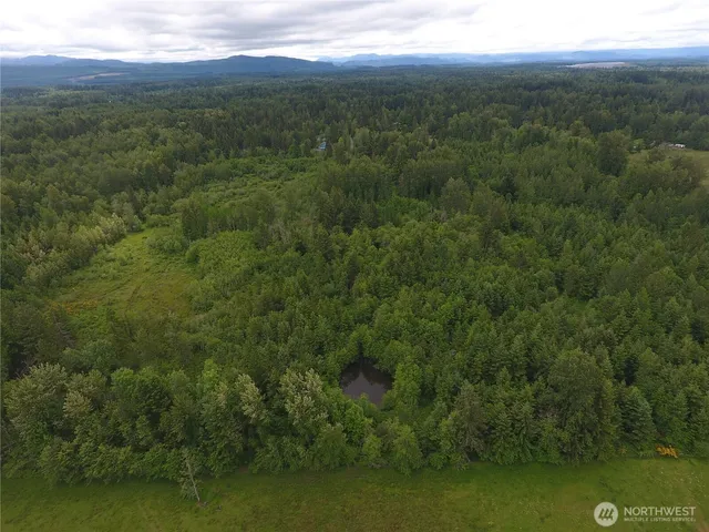 a view of an ocean and mountain