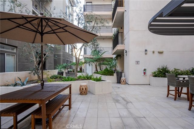 a view of a backyard with sitting area