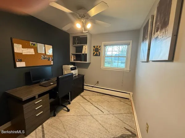 a room with hard wood floor and shoes
