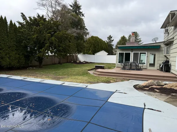 a house view with a swimming pool