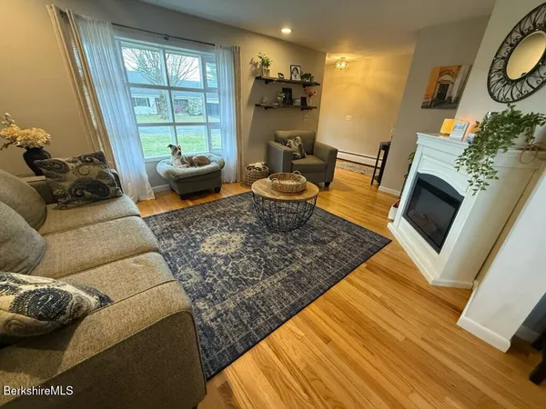 a living room with furniture and a rug