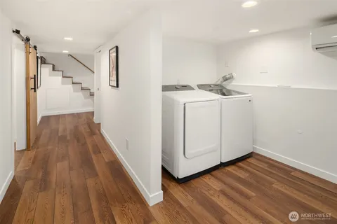 a view of a kitchen with wooden floor