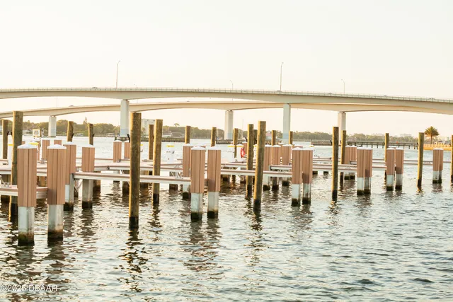 a view of swimming pool with outdoor seating and yard in the back