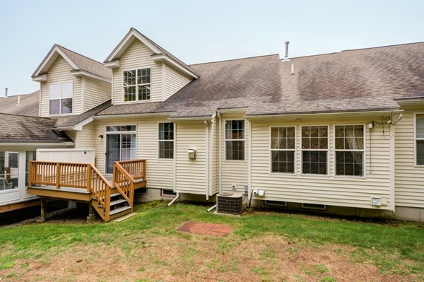 93 Brook Lane, Unit 93 Berlin, MA 01503 - Photo 29 of 29 a view of a house with a yard