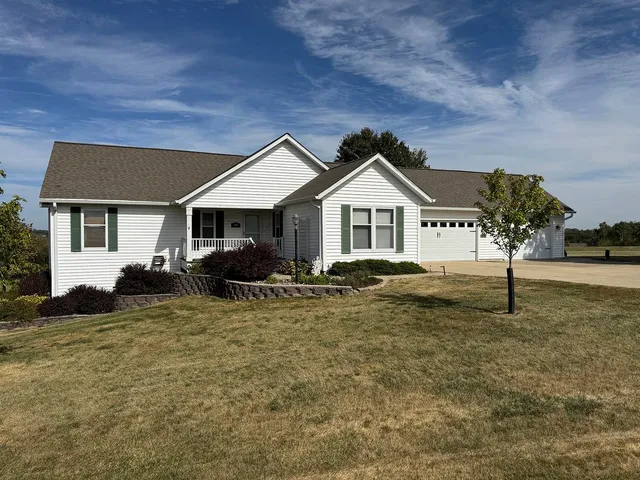 a house view with a garden space
