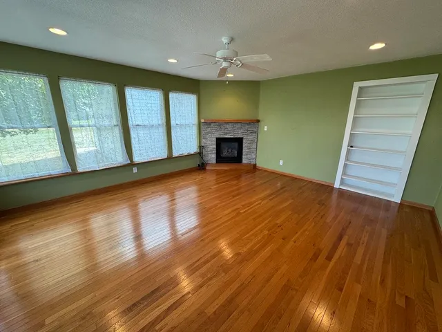 a view of a livingroom with furniture and a lamp