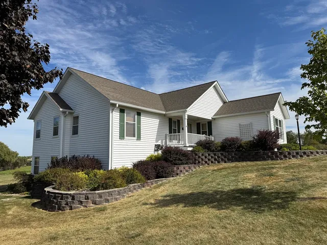a view of a livingroom with a hardwood floor and a ceiling fan