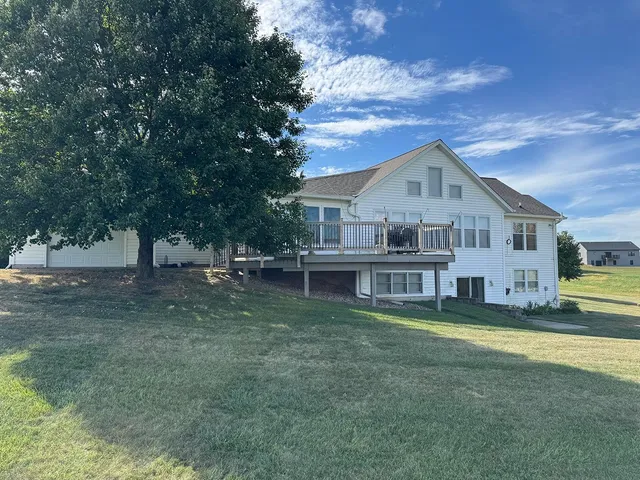 a living room with a fireplace and a flat screen tv