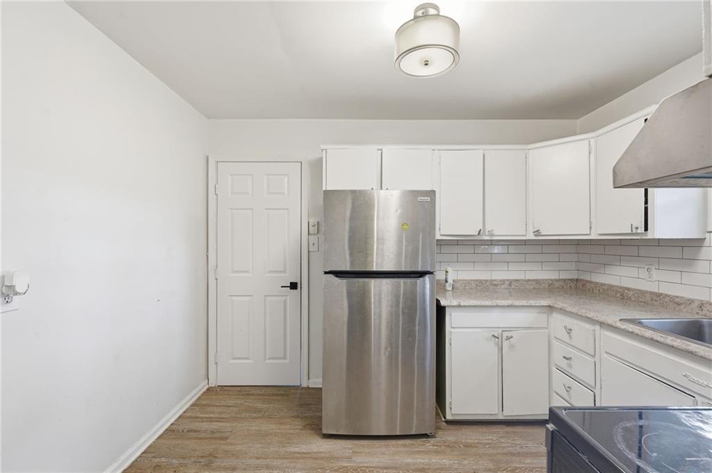 1739 Cardinal Road Hampton, GA 30228 - Photo 13 of 27 a white refrigerator freezer sitting inside of a kitchen