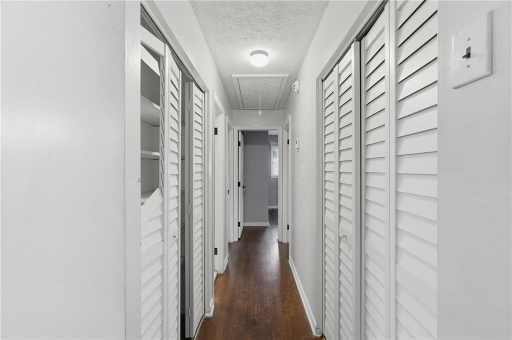 1739 Cardinal Road Hampton, GA 30228 - Photo 14 of 27 a view of a hallway with wooden floor and staircase