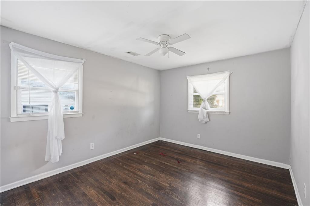 1739 Cardinal Road Hampton, GA 30228 - Photo 19 of 27 a view of empty room with wooden floor and fan