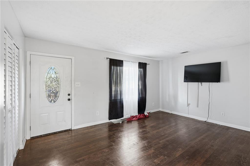 1739 Cardinal Road Hampton, GA 30228 - Photo 4 of 27 a view of livingroom with wooden floor and window