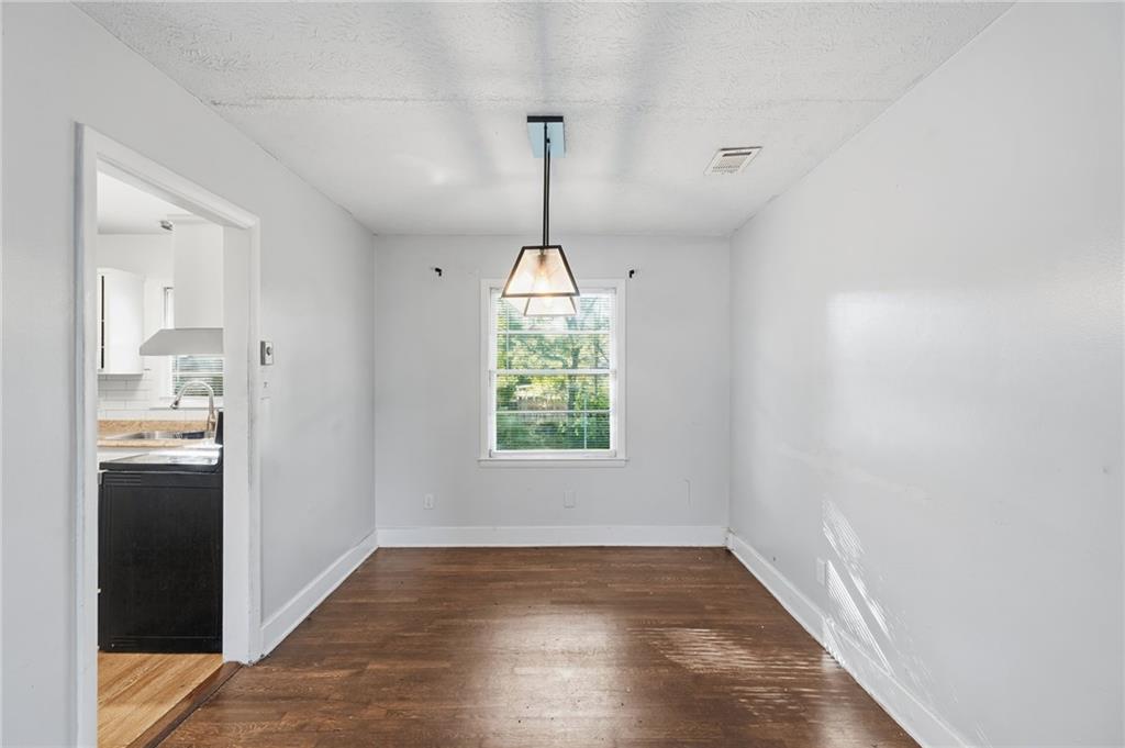 1739 Cardinal Road Hampton, GA 30228 - Photo 10 of 27 a view of empty room with wooden floor and window