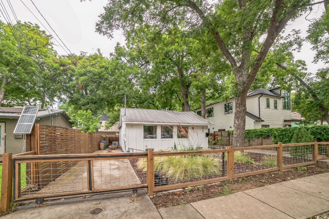 a view of house with outdoor space and sitting area