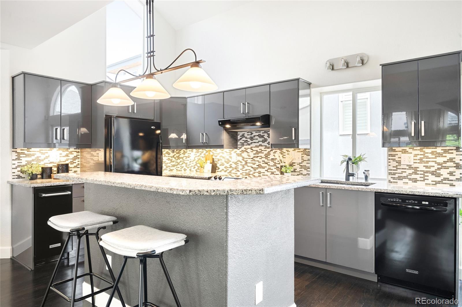550 Madison Street Denver, CO 80206 - Photo 11 of 39 a kitchen with a table and chairs in it