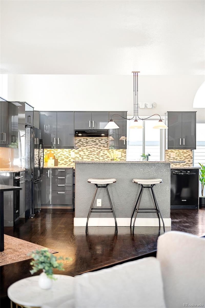 550 Madison Street Denver, CO 80206 - Photo 15 of 39 a view of a living room and kitchen