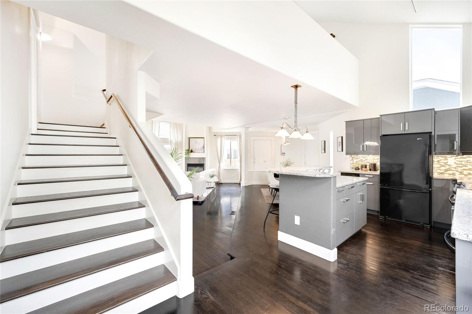 550 Madison Street Denver, CO 80206 - Photo 16 of 39 a kitchen with refrigerator and cabinets