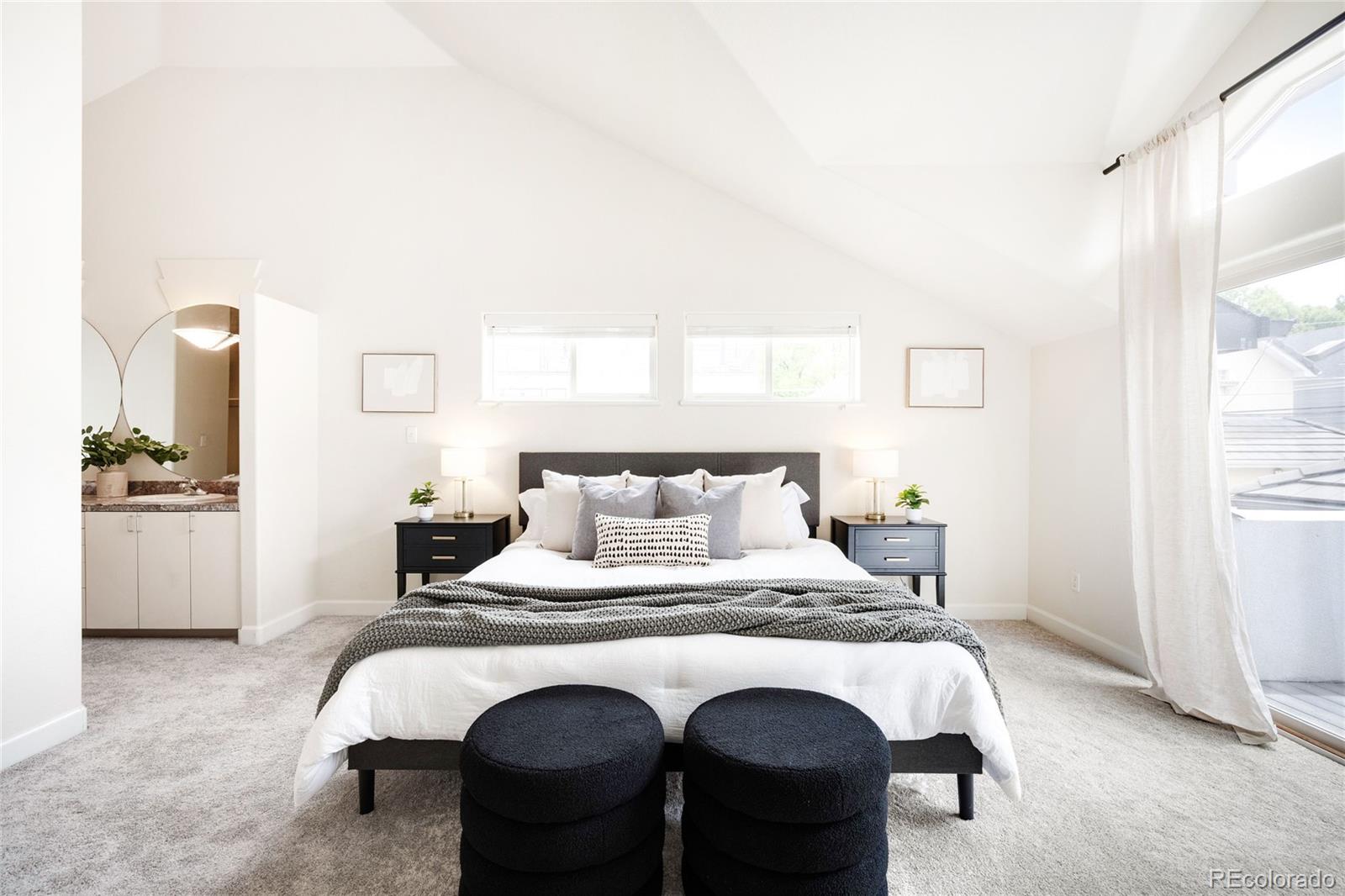 550 Madison Street Denver, CO 80206 - Photo 17 of 39 a bedroom with a bed and a refrigerator