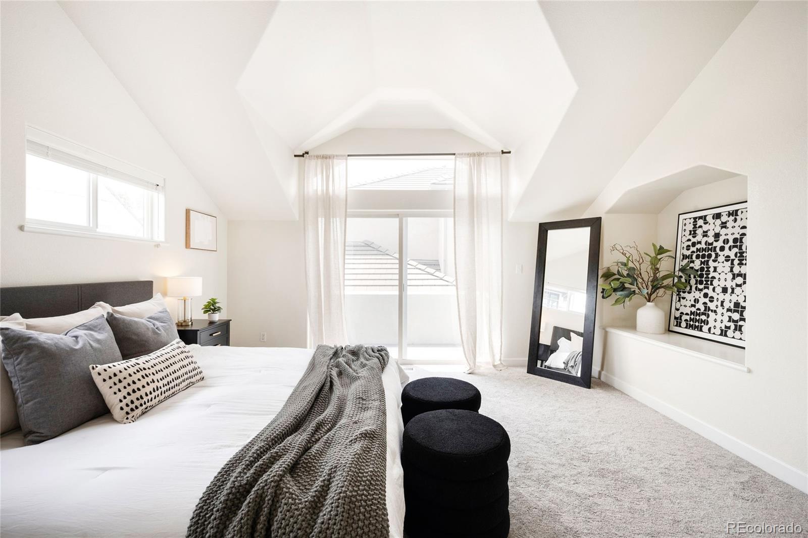 550 Madison Street Denver, CO 80206 - Photo 18 of 39 a bedroom with furniture and a large window