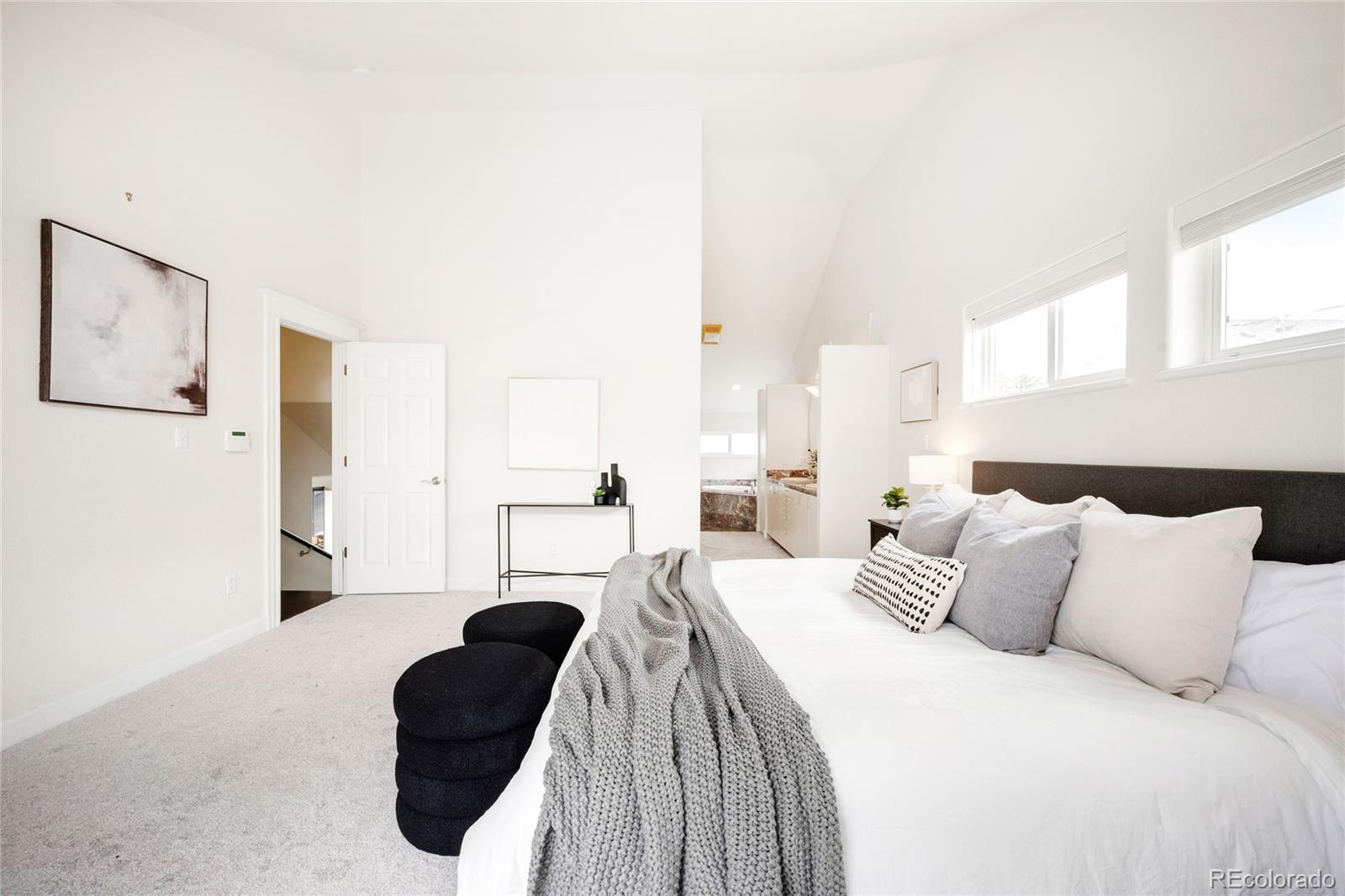 550 Madison Street Denver, CO 80206 - Photo 19 of 39 a bedroom with a bed and a couch