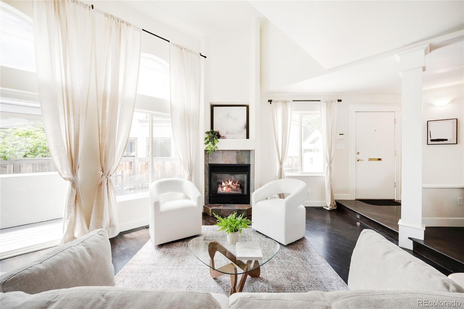 550 Madison Street Denver, CO 80206 - Photo 2 of 39 a living room with furniture and a fireplace
