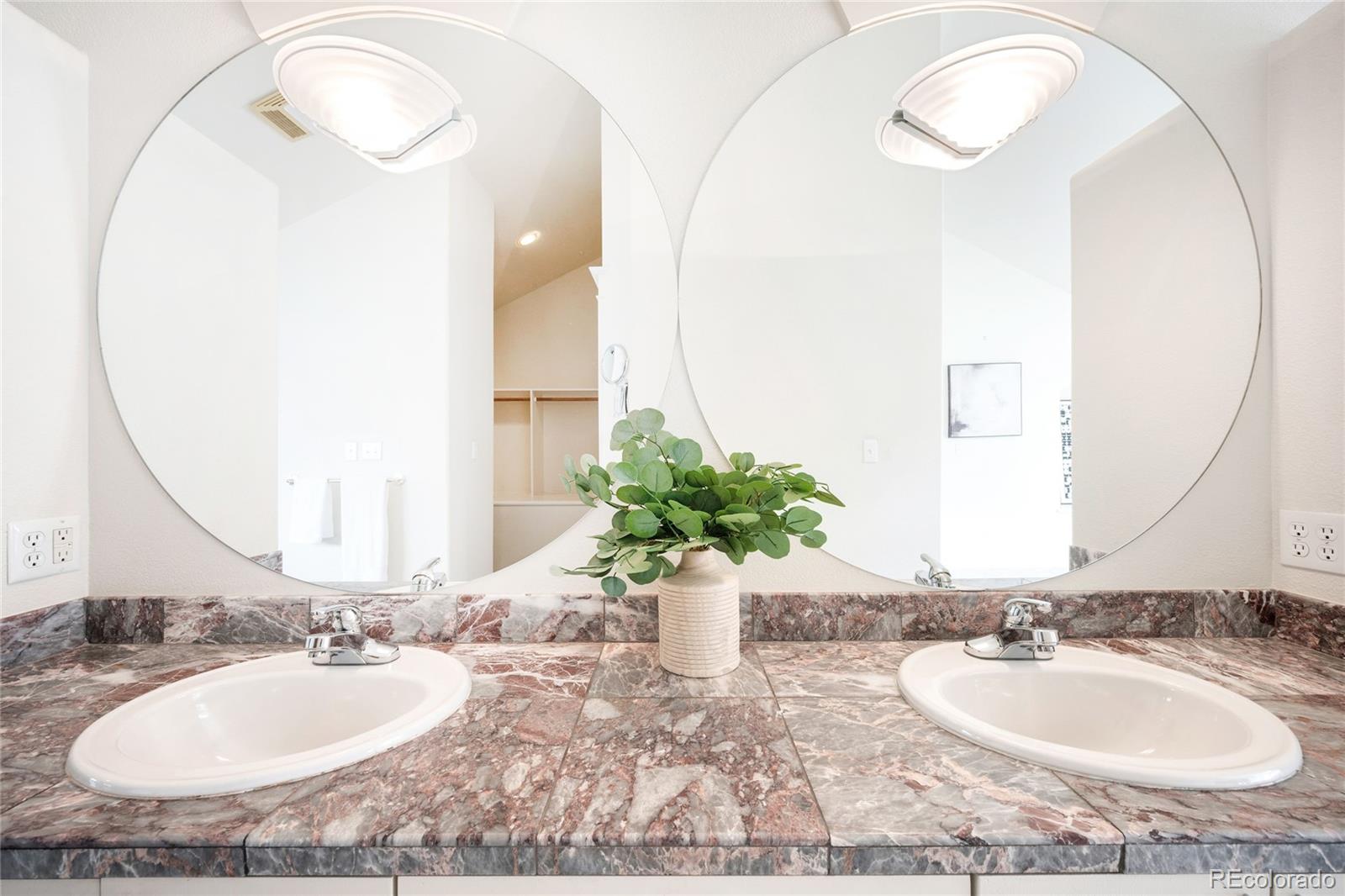 550 Madison Street Denver, CO 80206 - Photo 22 of 39 a bathroom with a granite countertop sink and a mirror