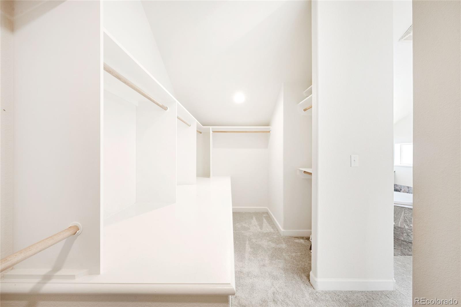 550 Madison Street Denver, CO 80206 - Photo 25 of 39 a view of a hallway with white walls