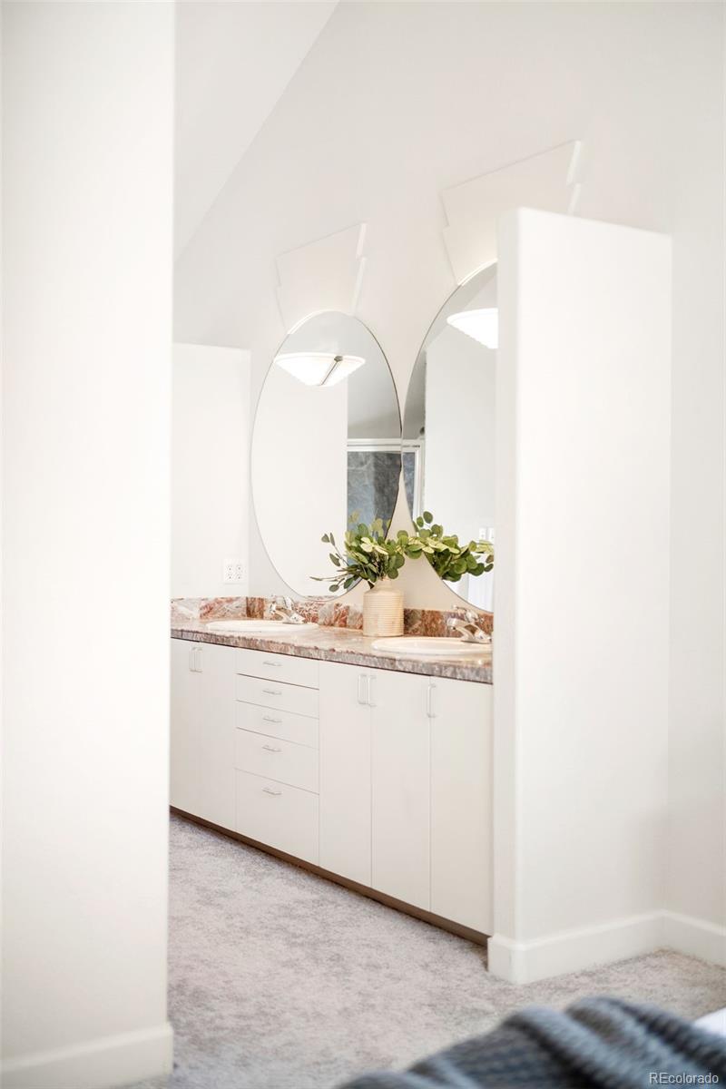 550 Madison Street Denver, CO 80206 - Photo 26 of 39 a bathroom with a sink and a mirror