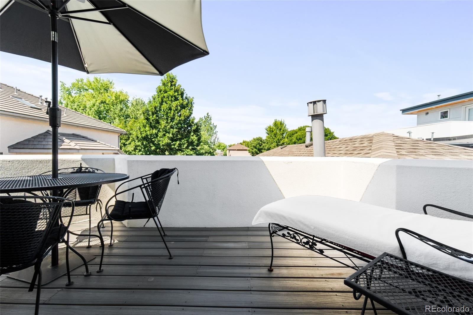 550 Madison Street Denver, CO 80206 - Photo 30 of 39 a view of a terrace with furniture and garden