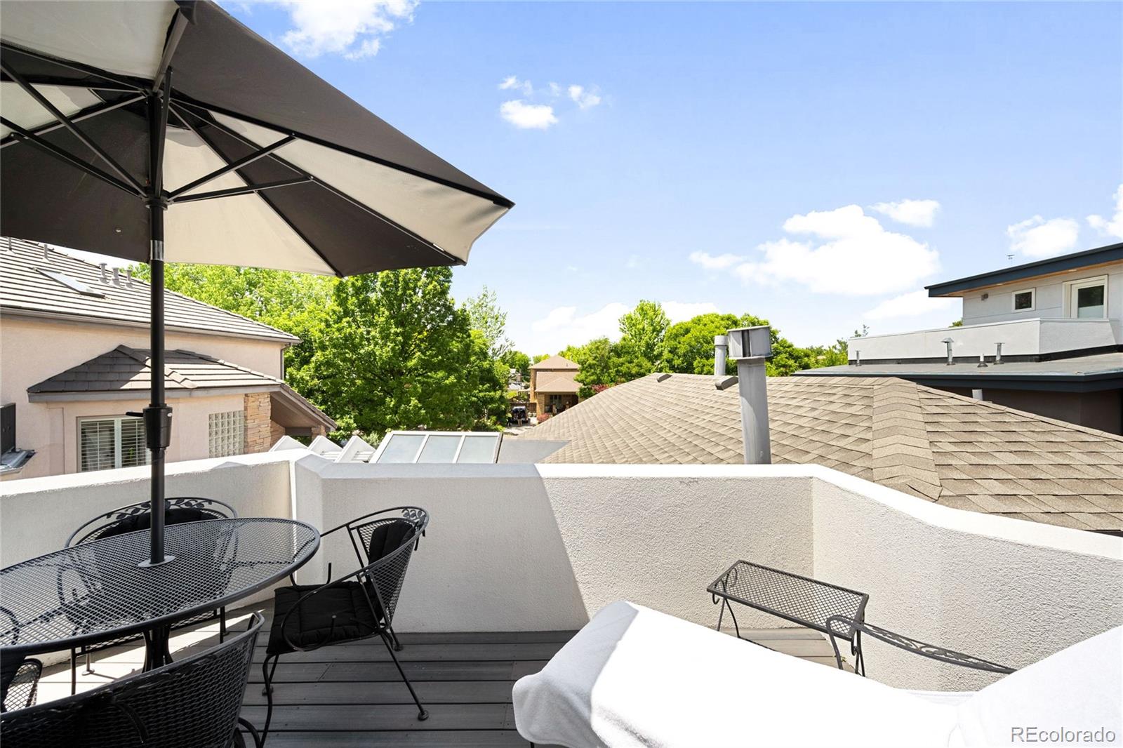 550 Madison Street Denver, CO 80206 - Photo 32 of 39 a view of a patio with table and chairs