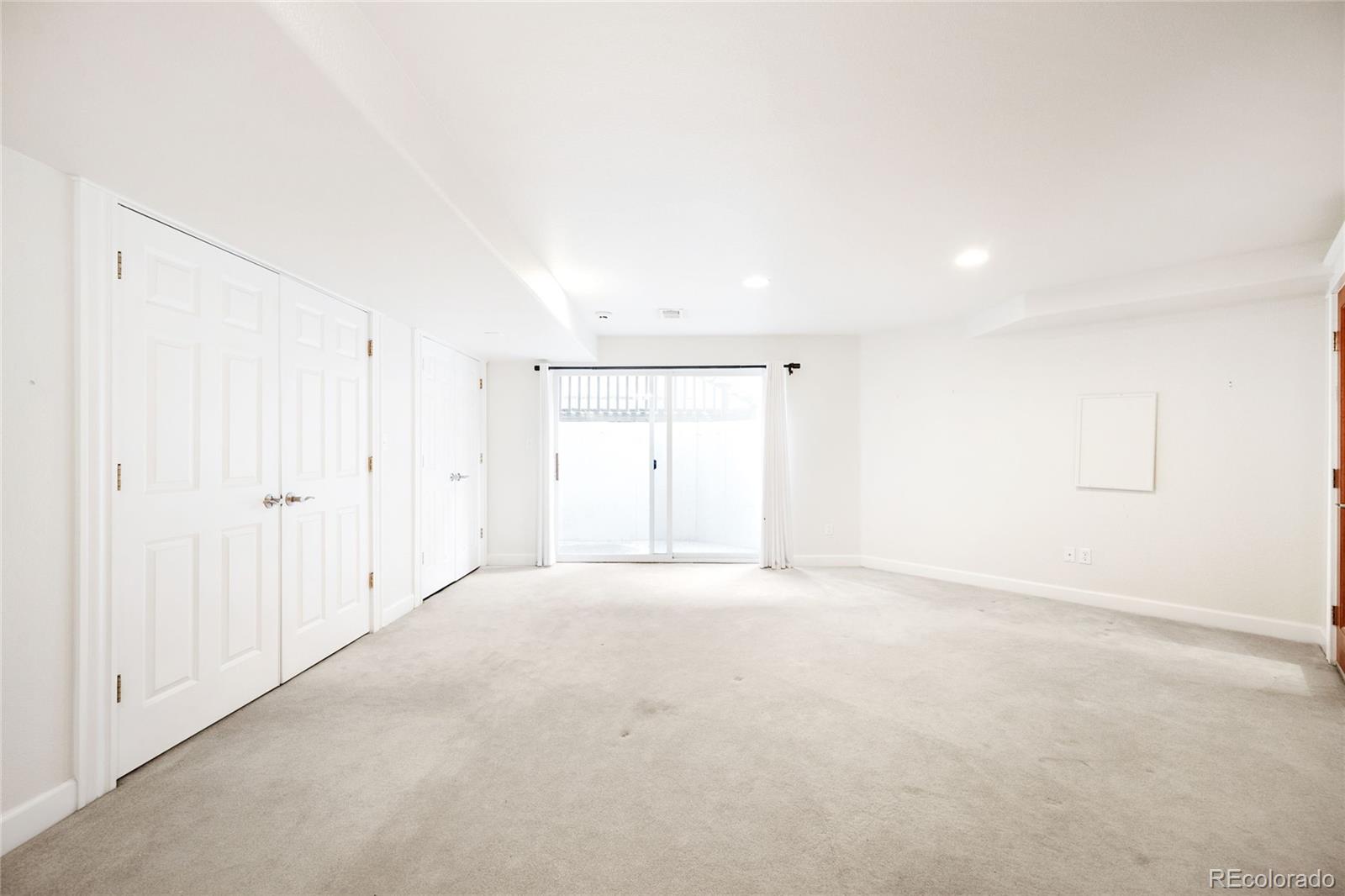 550 Madison Street Denver, CO 80206 - Photo 34 of 39 a view of an empty room with a window