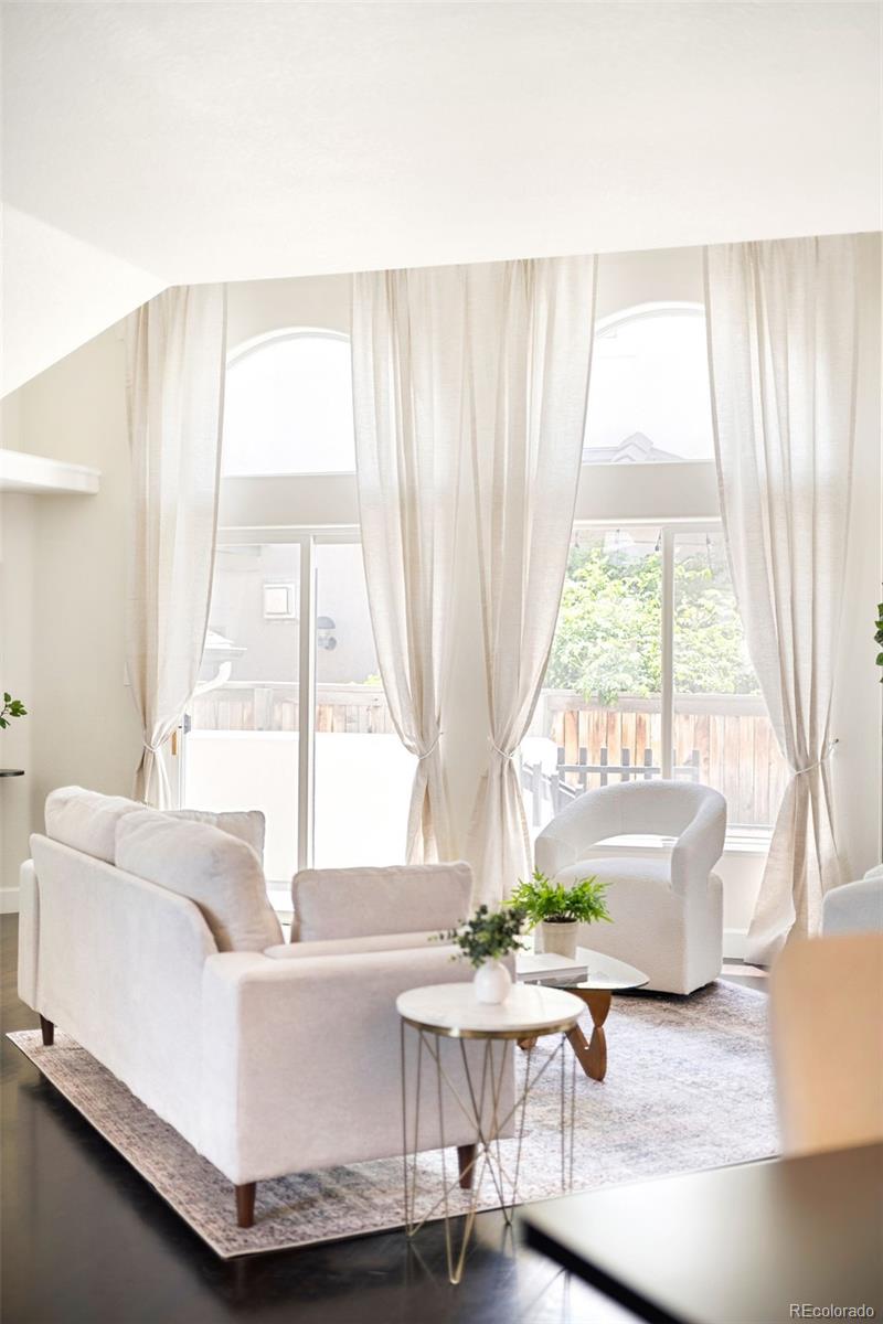 550 Madison Street Denver, CO 80206 - Photo 5 of 39 a living room with furniture and a large window