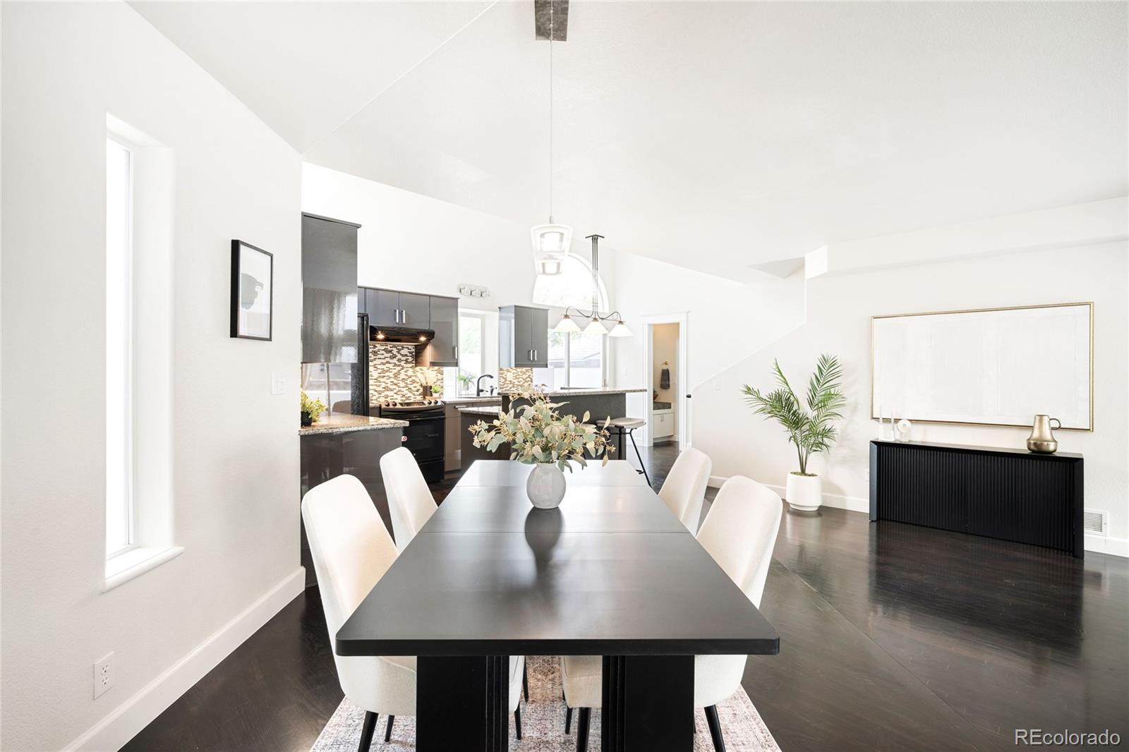 550 Madison Street Denver, CO 80206 - Photo 7 of 39 a view of a dining room with furniture window and wooden floor