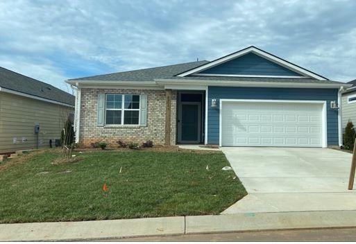6255 Scuttle Lane, Unit 1104 Denver, NC 28037 - Photo 1 of 1 front view of a house with a yard