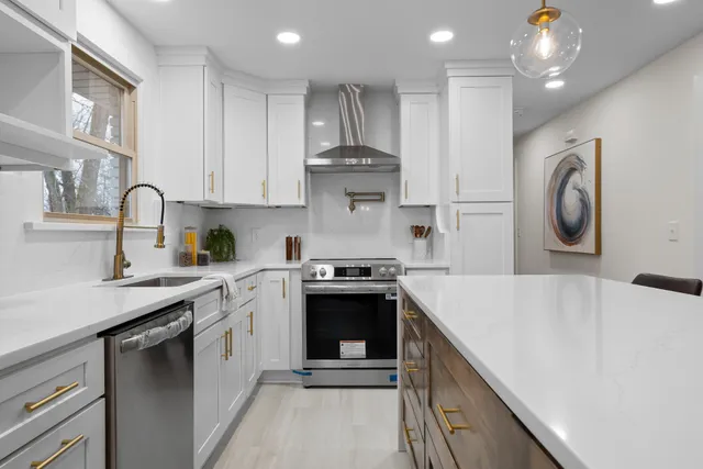 a kitchen with a stove and a sink