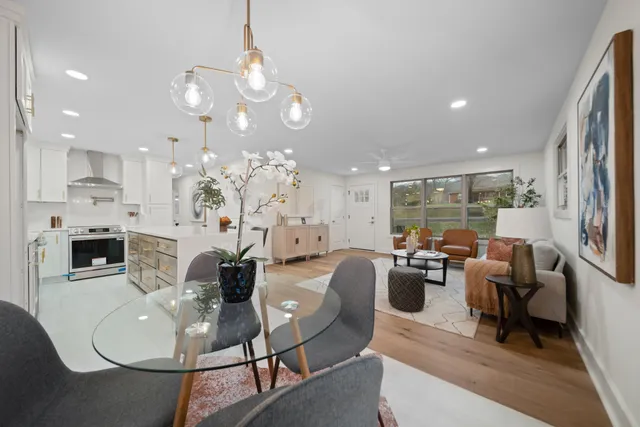 a living room with fireplace furniture and a flat screen tv