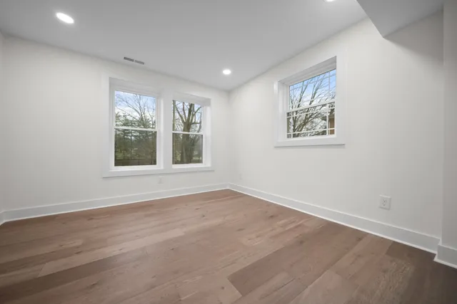 a view of an entryway with wooden floor
