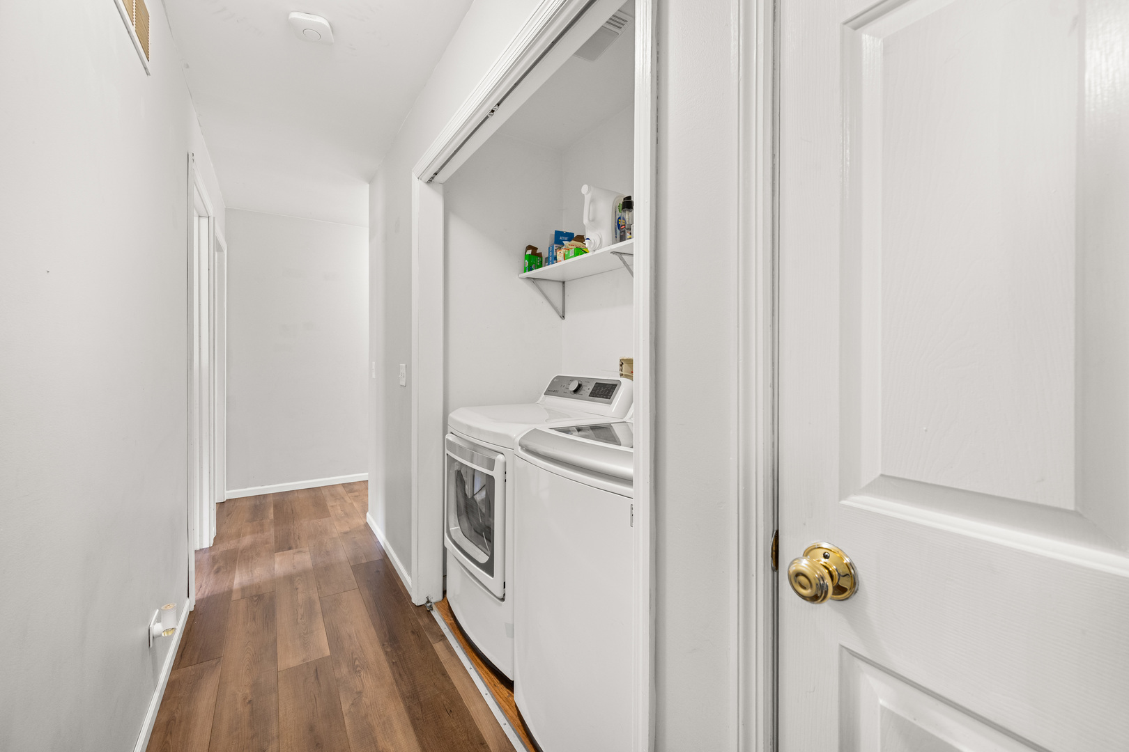 323 West Church Street Genoa, IL 60135 - Photo 11 of 28 a view of a hallway with washer and dryer