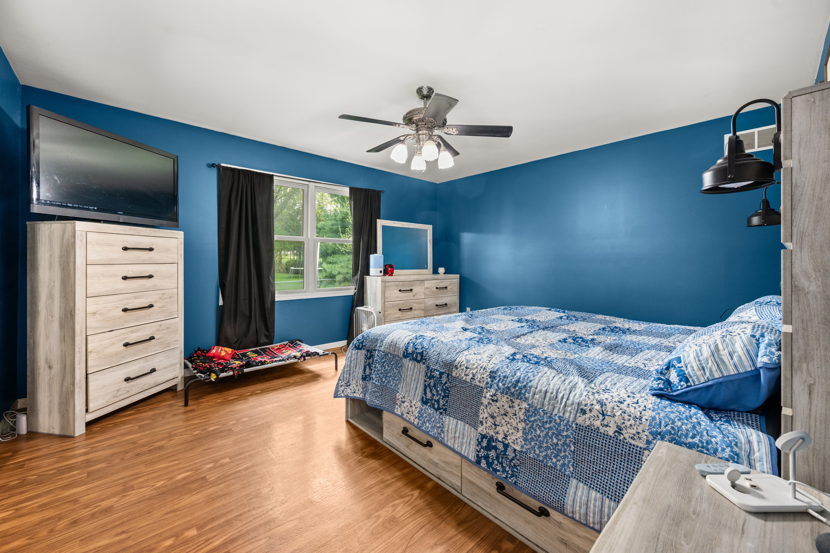 323 West Church Street Genoa, IL 60135 - Photo 15 of 28 a bedroom with a bed and wooden floor